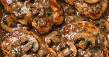 Creamy bacon mushroom pork chops in a baking dish