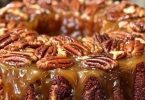 Pecan Upside Down Cake with glossy caramel sauce and toasted pecans