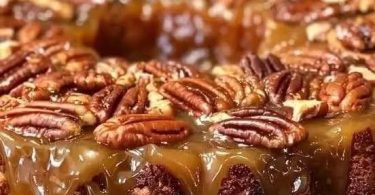 Pecan Upside Down Cake with glossy caramel sauce and toasted pecans