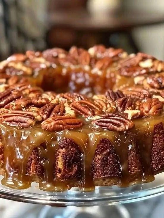 Pecan Upside Down Cake with glossy caramel sauce and toasted pecans