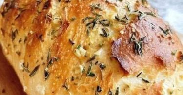 Freshly baked no-knead bread loaf with a golden-brown crust