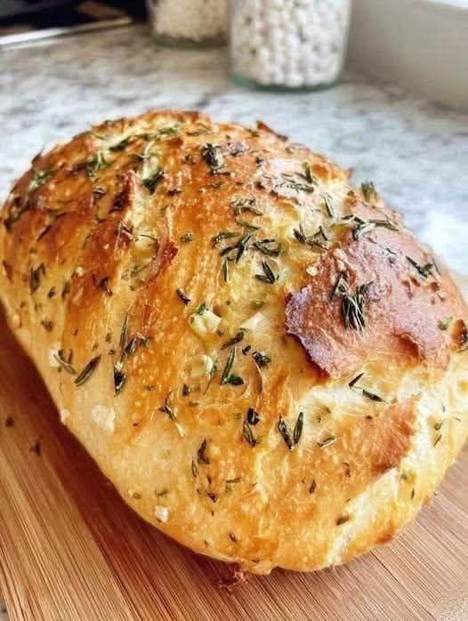 Freshly baked no-knead bread loaf with a golden-brown crust