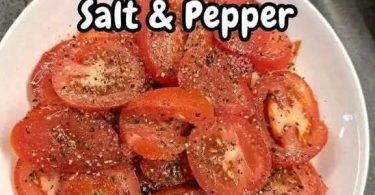Sliced tomato with salt and freshly cracked black pepper